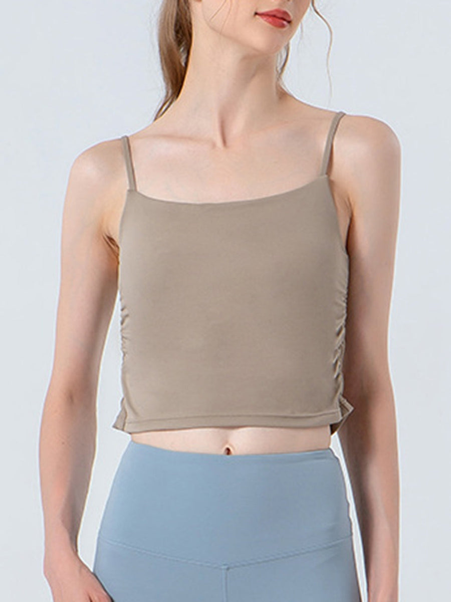 Beige ruched side tank top with spaghetti straps and a square neckline.