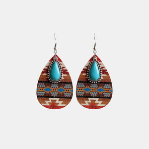 Southwestern print teardrop earrings with turquoise stone and alloy details.