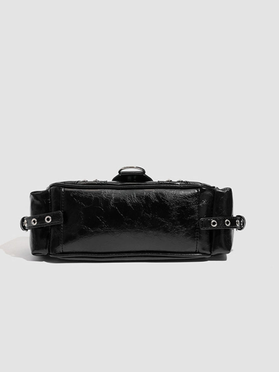 shoulder bag in black with crocodile-embossed and rivet embellishment