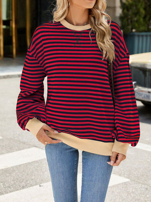 Striped crew neck sweatshirt in red and navy with tan trim and cuffs.