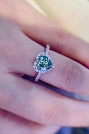 Green heart-cut moissanite halo ring with pave band.