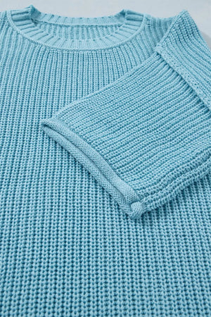 Relaxed blue ribbed knit sweater top with crew neck and cuffed sleeves.