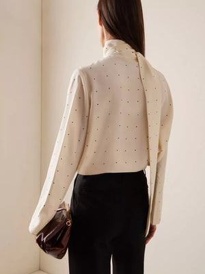 ivory blouse with cuffed sleeves and long sleeve