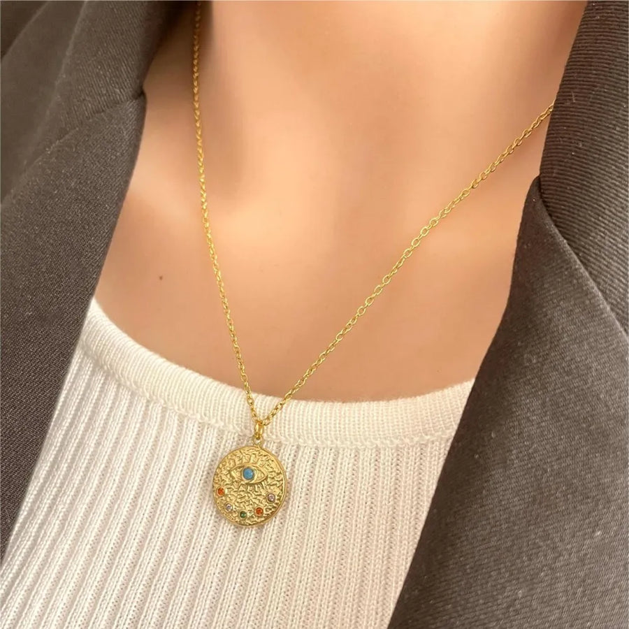 blue necklace featuring 18K gold-plated and geometric