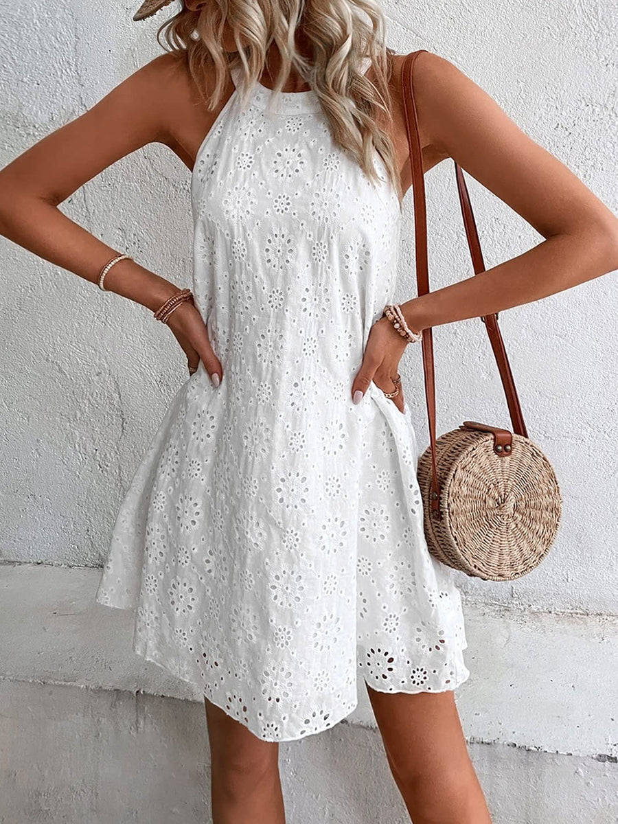 White eyelet halter trapeze dress with floral embroidery and scalloped hem