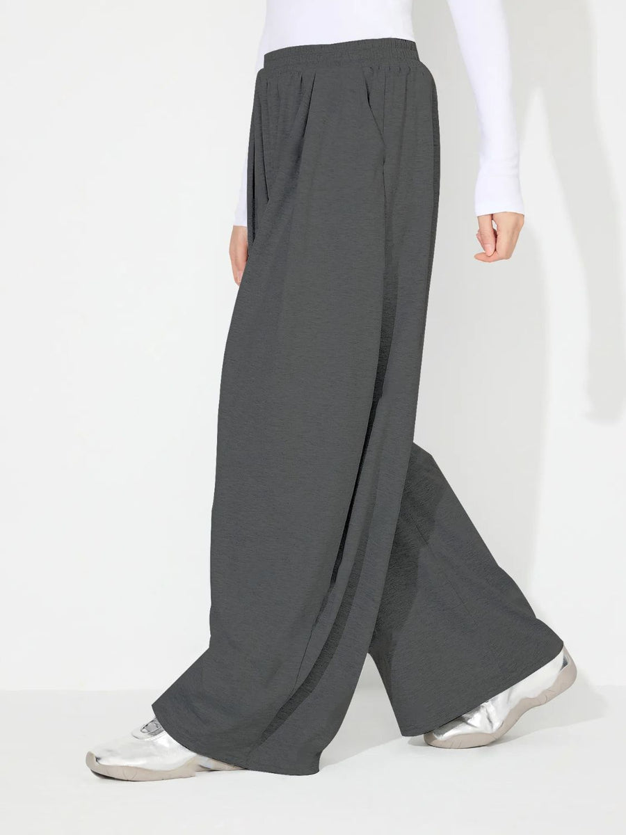 Dark Gray pleated drape palazzo trousers with a wide leg and elastic waistband.