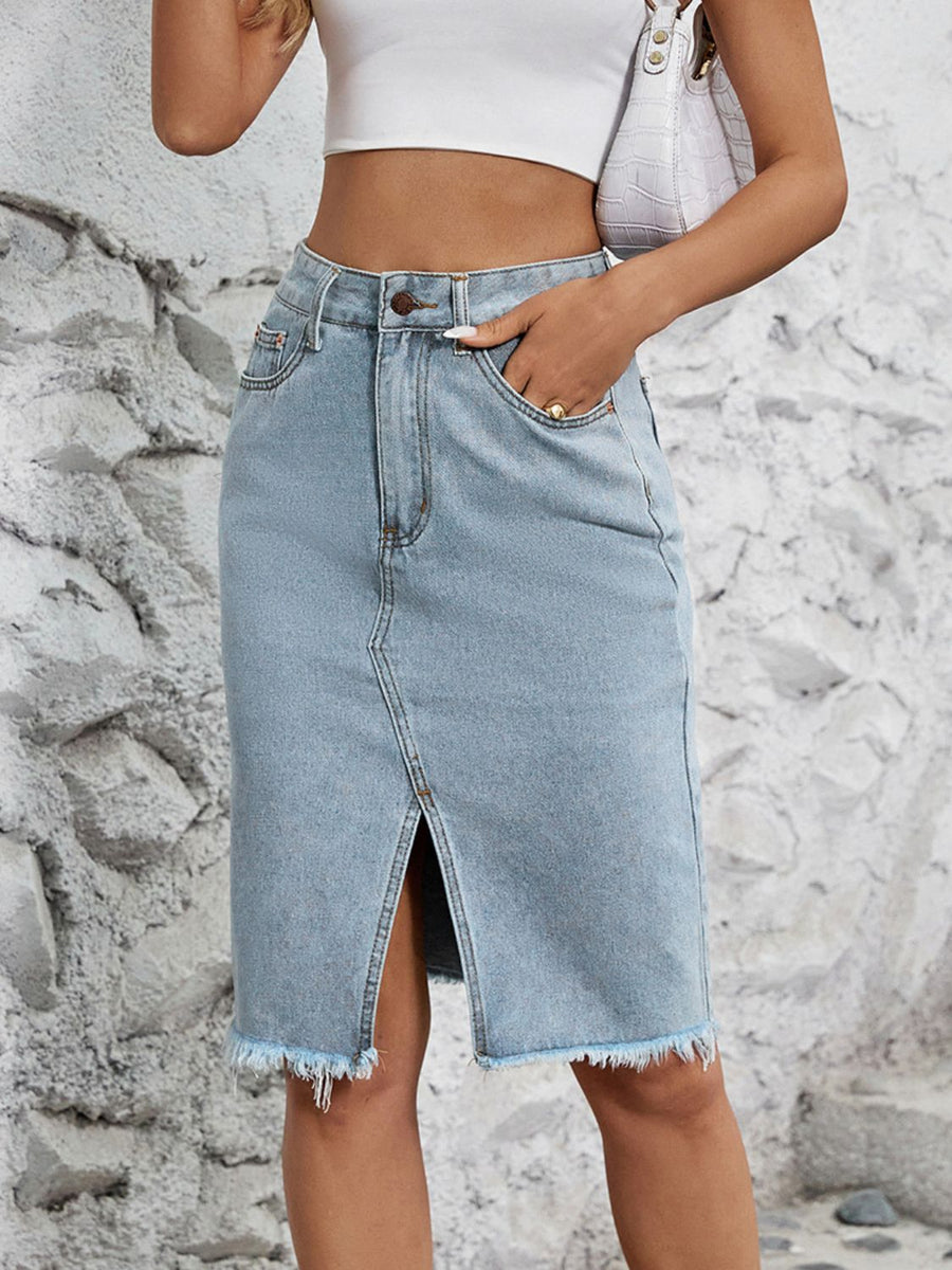 Light blue denim pencil skirt with front slit and frayed hem.