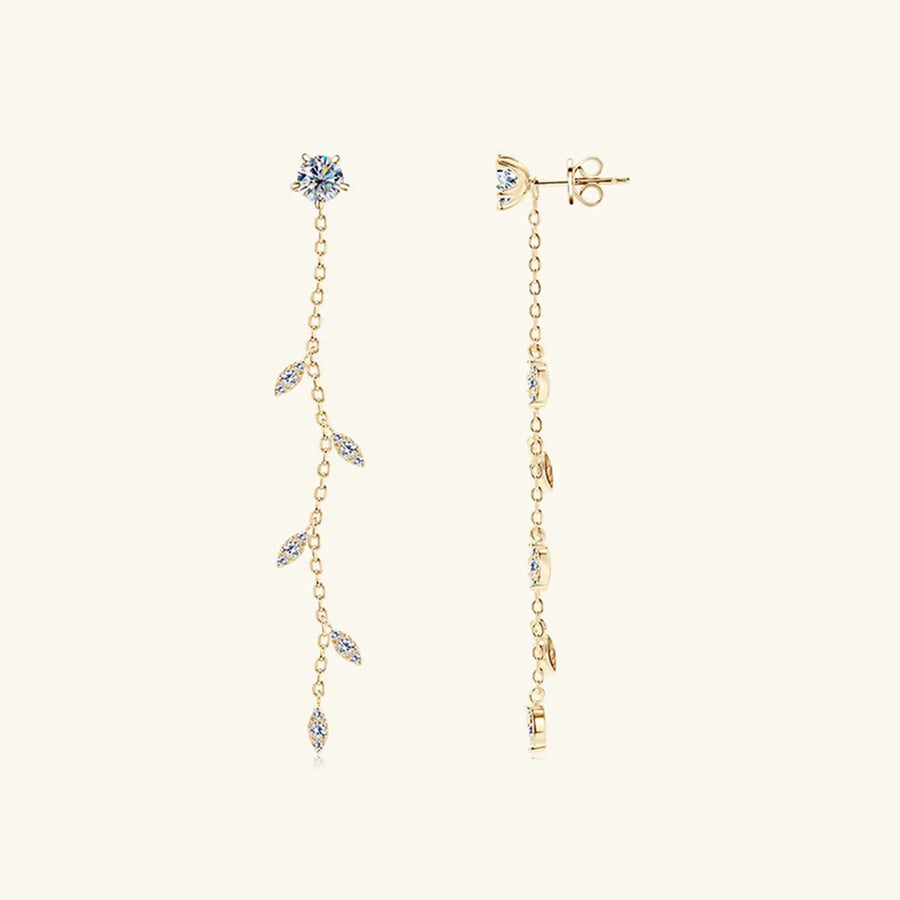 Gold dangling crystal vine earrings with delicate chain and leaf-shaped accents.