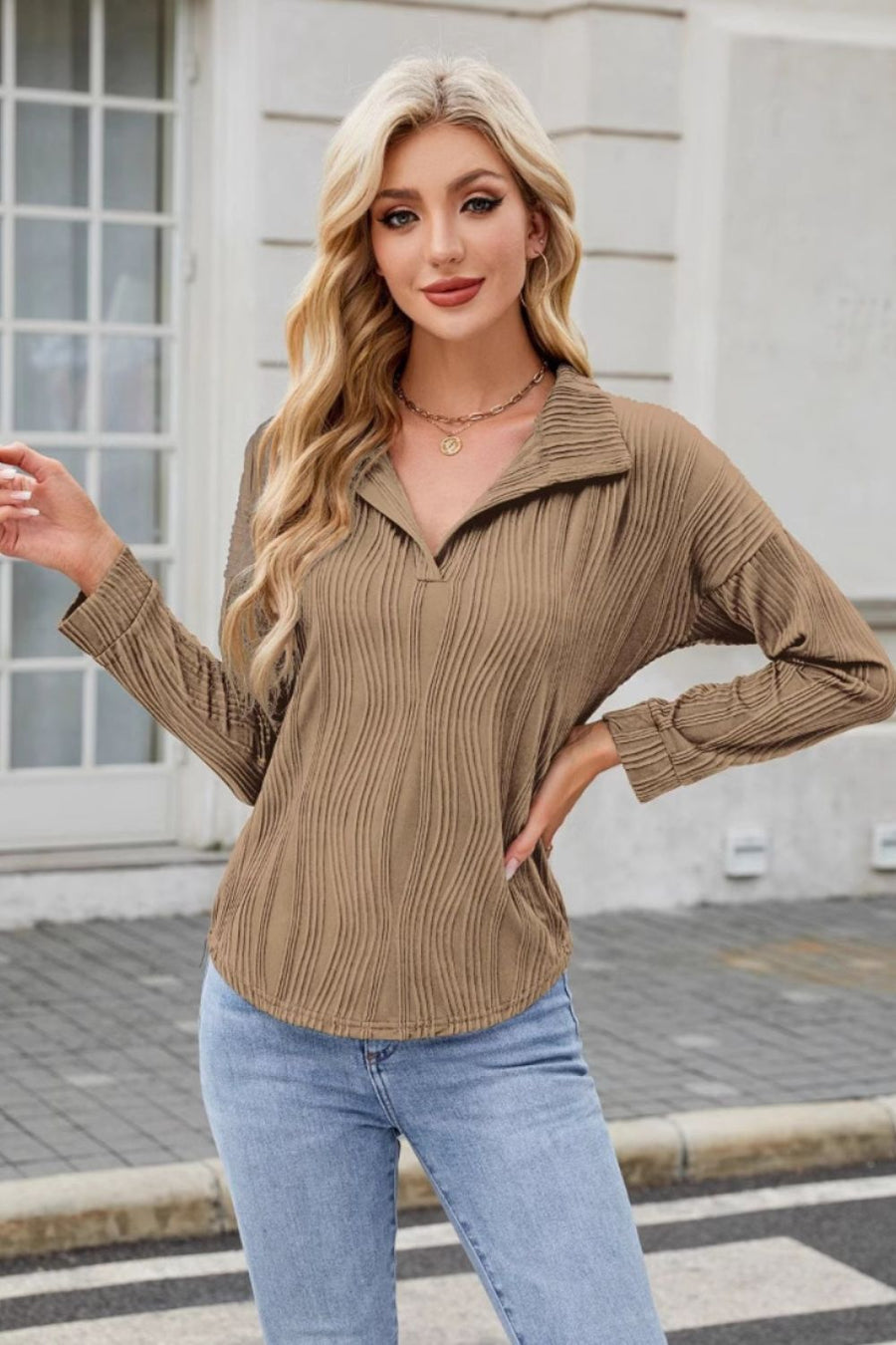 Taupe wave-effect collared long sleeve blouse with a V-neck and textured fabric.