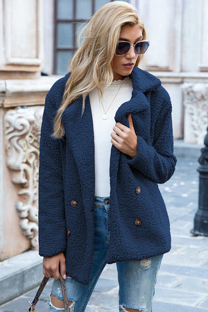 Dark Blue teddy pea coat with double-breasted closure and button details.