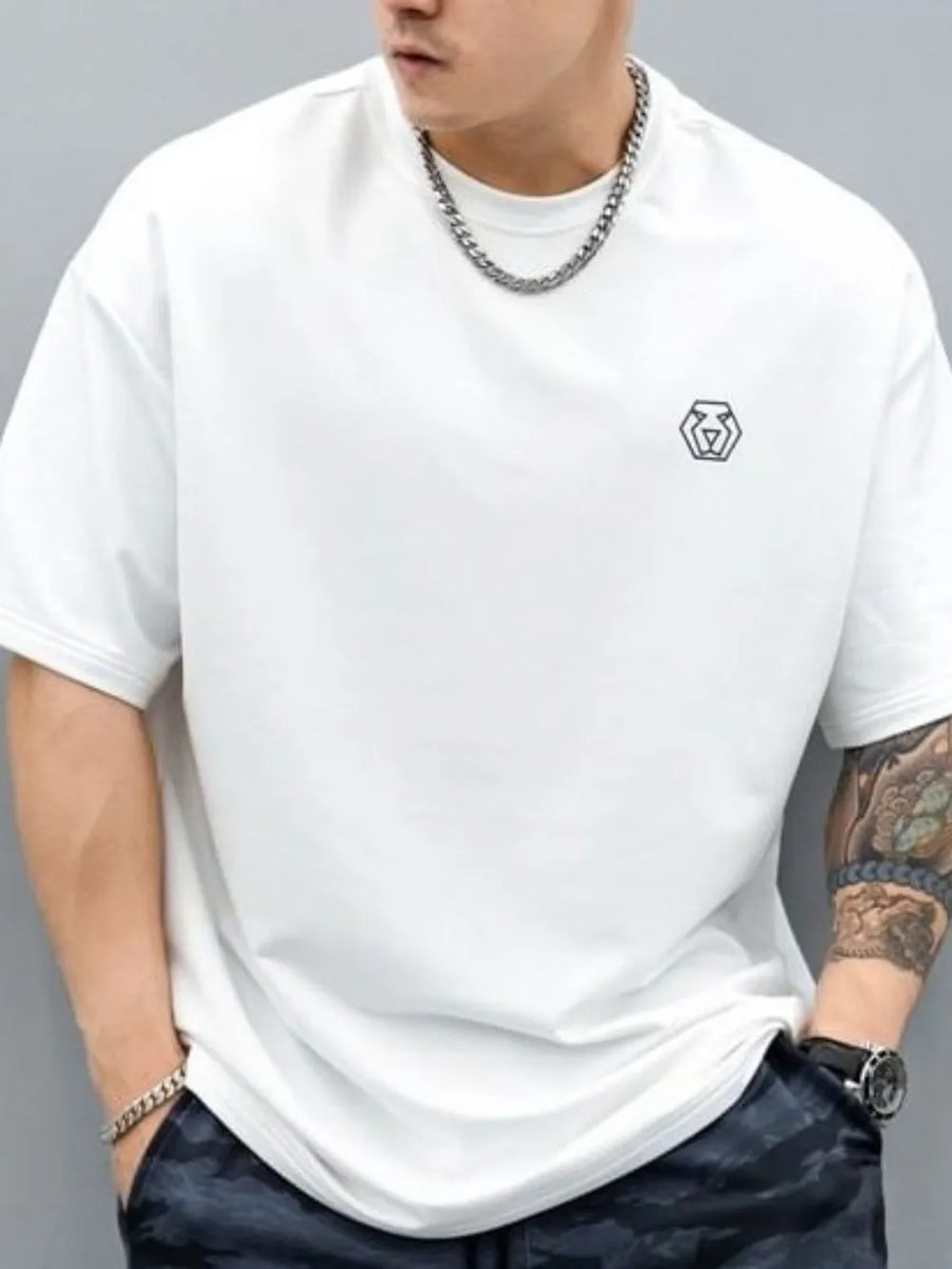 White oversized t-shirt with minimalist emblem detail on chest