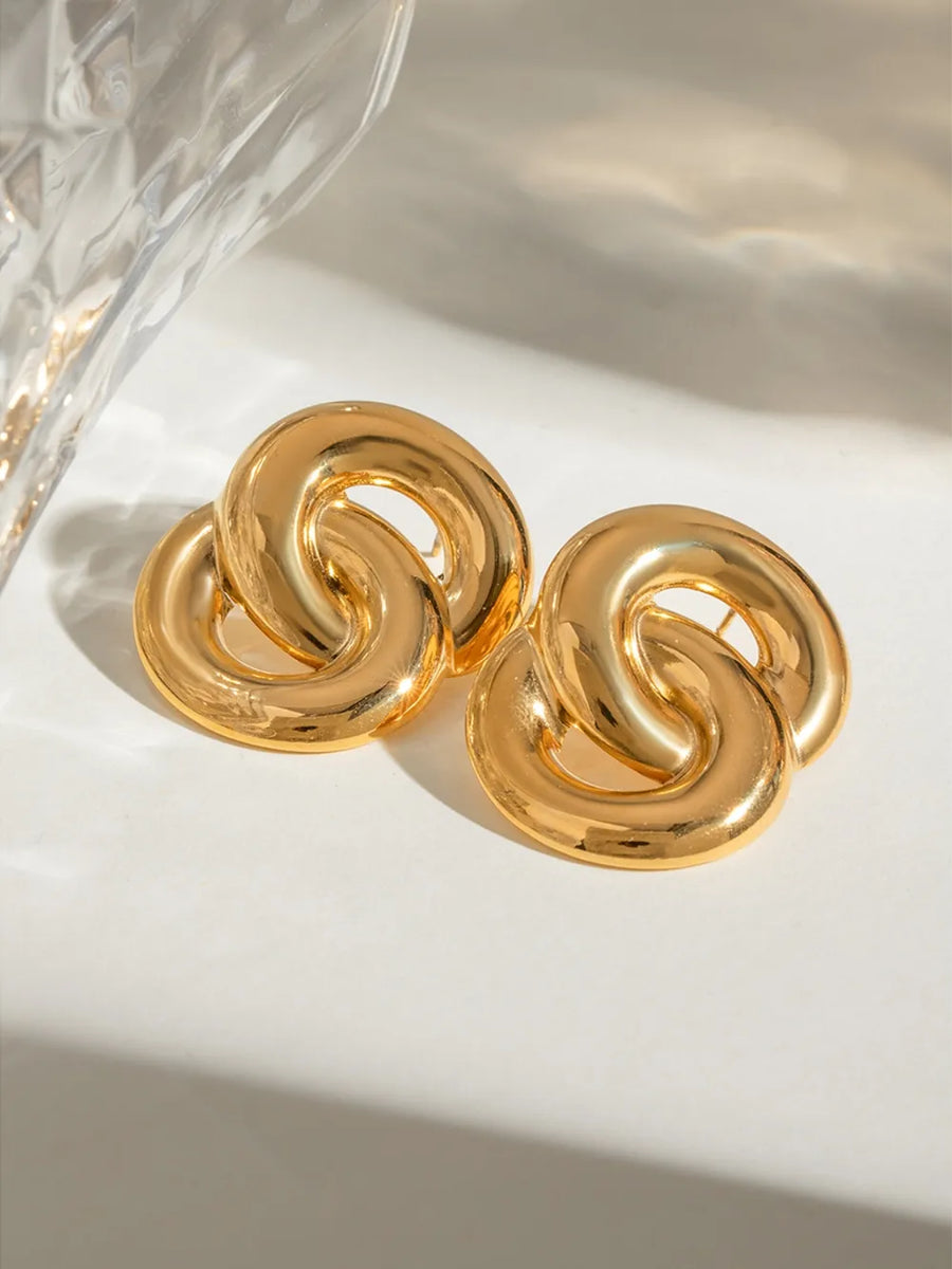 Gold interlocking statement earrings with 18K gold plating.