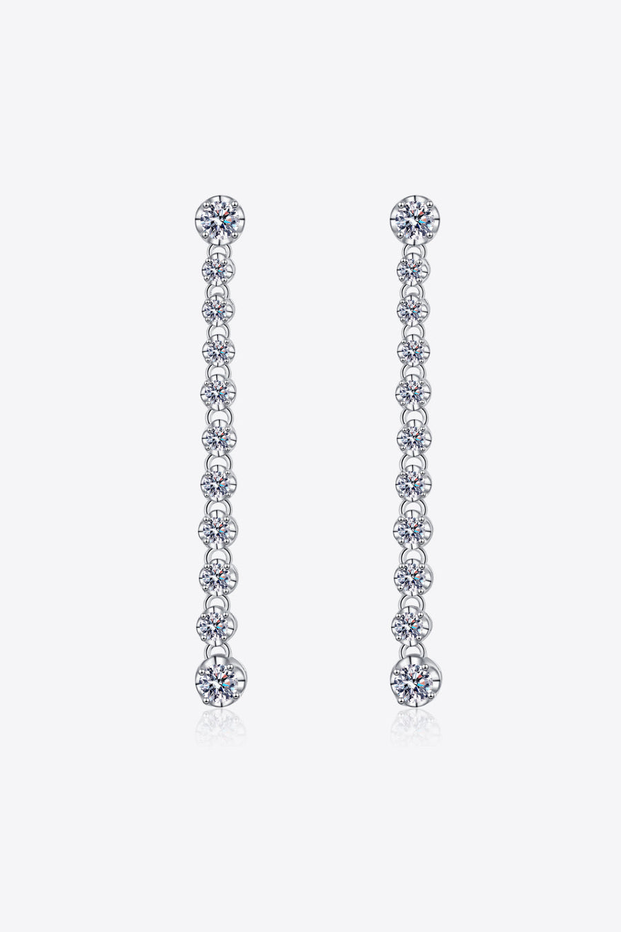 Silver linear drop earrings with multiple moissanite stones cascading down.