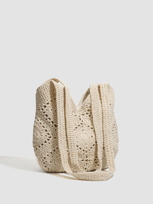 Beige handbag featuring crochet knit and geometric