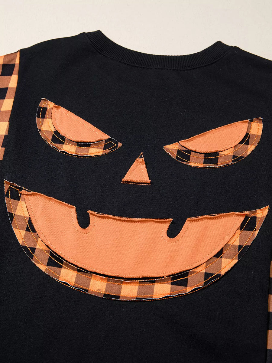 black t-shirt with plaid accents and long sleeve