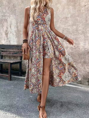 Vibrant paisley print overlay romper with cinched waist and dramatic slit.
