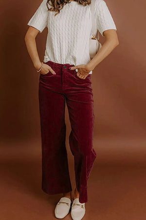 wide-leg pants in burgundy featuring high-waisted and flared fit