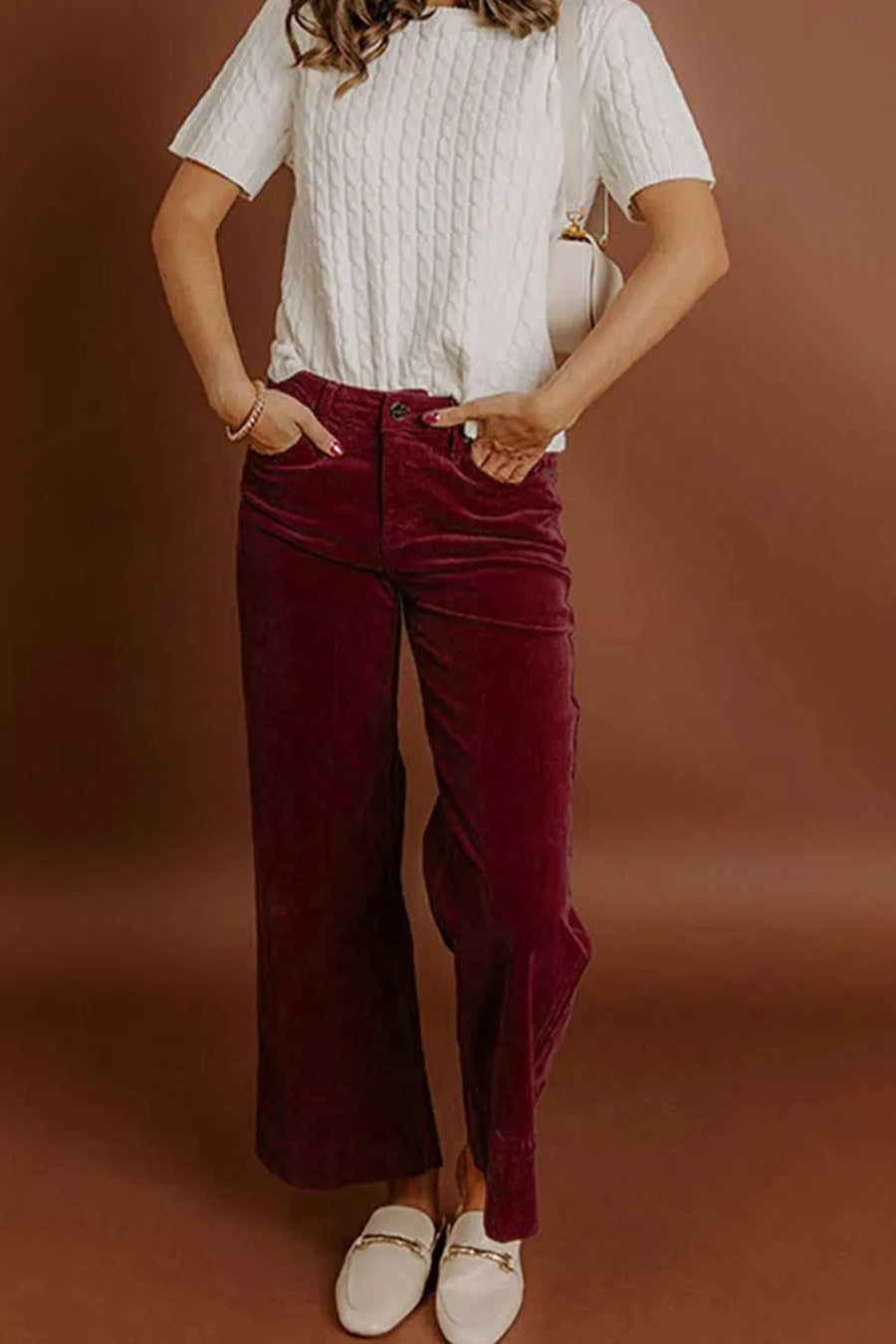 wide-leg pants in burgundy featuring high-waisted and flared fit