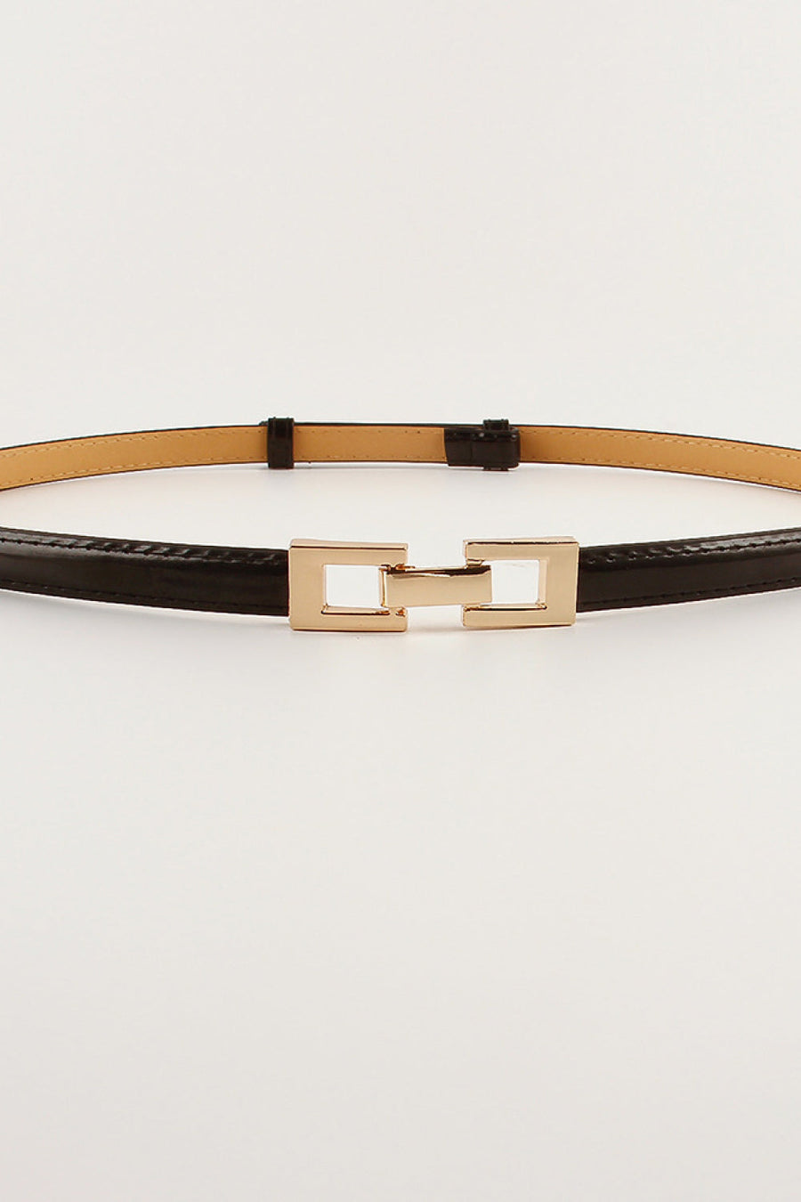 Black leather belt with gold geometric buckle detail