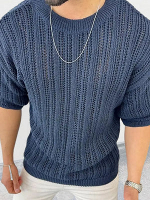 Navy open-knit crew neck sweater with boxy fit and short sleeves.