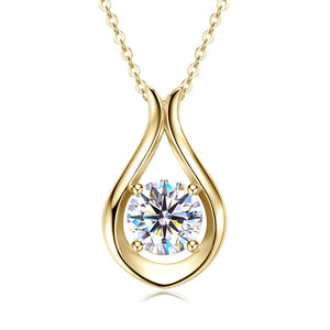 Gold teardrop pendant necklace with a sparkling moissanite stone.