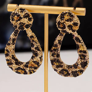 black earrings featuring dangle and leopard