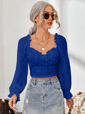 Royal blue bustier sleeve blouse with sweetheart neckline and tie detail