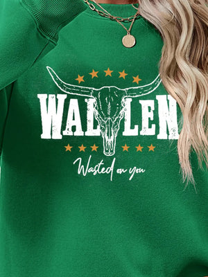 Green graphic sweatshirt with bull skull and text Wasted on you
