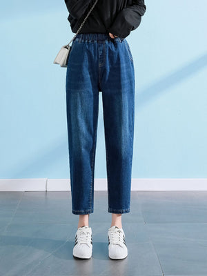 jeans in medium wash denim featuring washed and relaxed fit