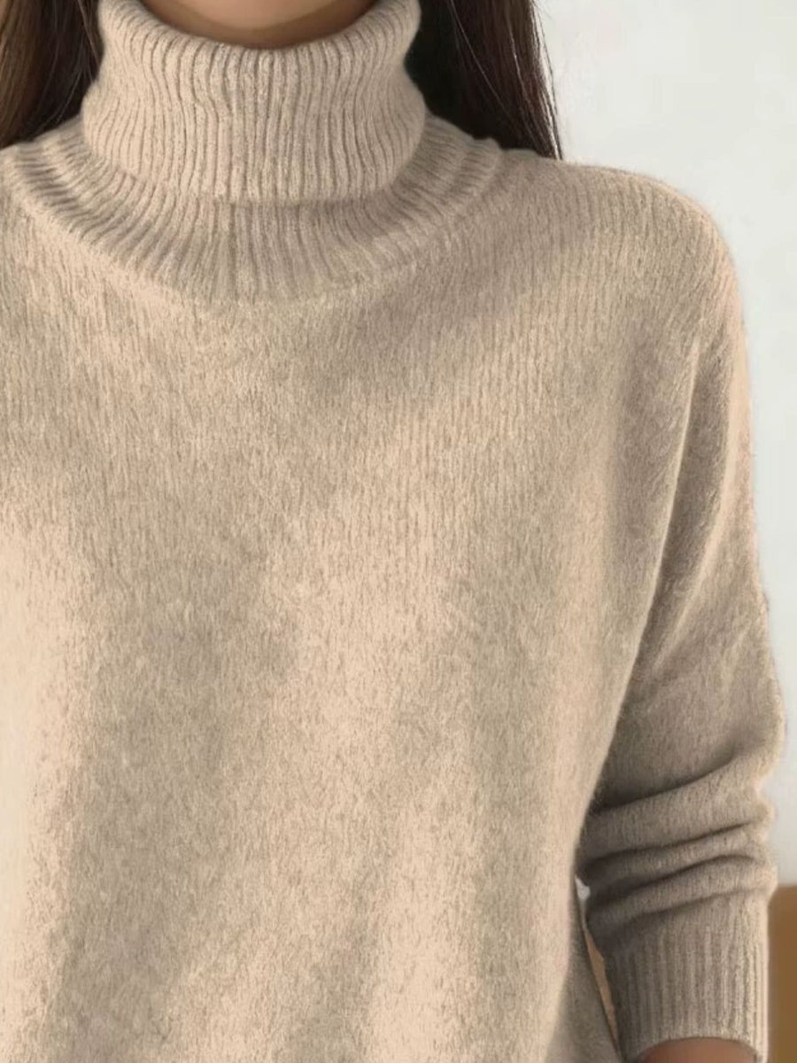 100% polyester Care instructions: Machine wash cold turtleneck sweater in Apricot with relaxed silhouette