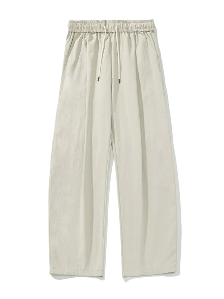 Balloon-fit drawstring trousers in taupe with a casual, wide-leg cut.