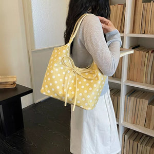 shoulder bag in yellow with polka dot and bowknot detail