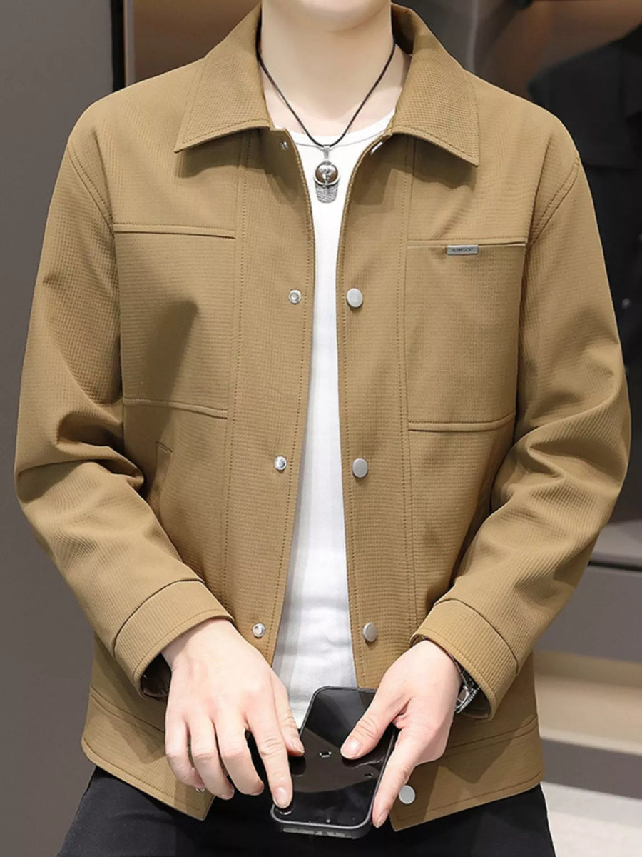 Men's caramel snap down jacket with textured fabric and chest pocket detail.