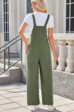 Moss green ribbed knit overalls with patch pockets and wide legs.