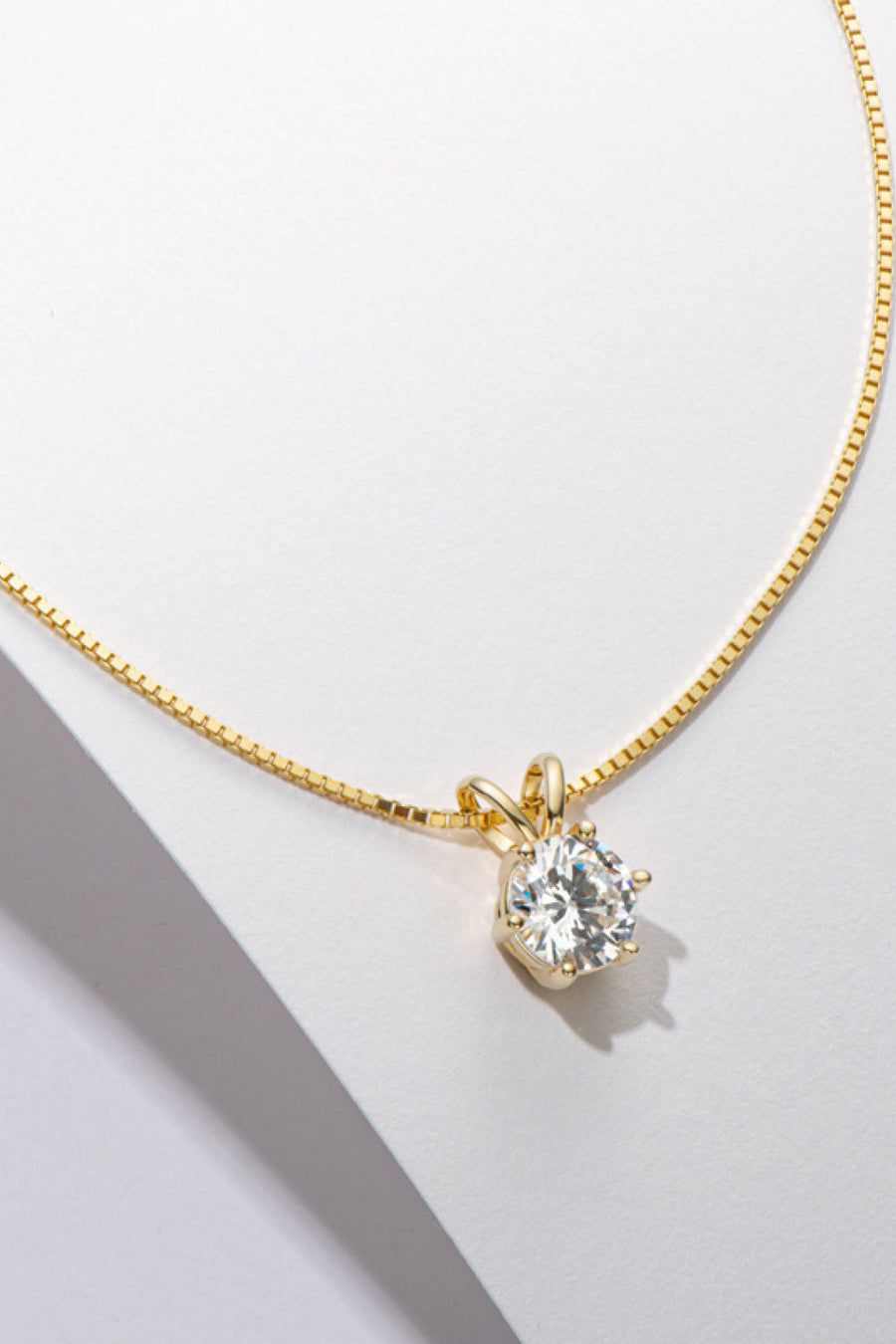 Gold moissanite pendant necklace with 1 carat round brilliant cut stone on 925 silver chain
