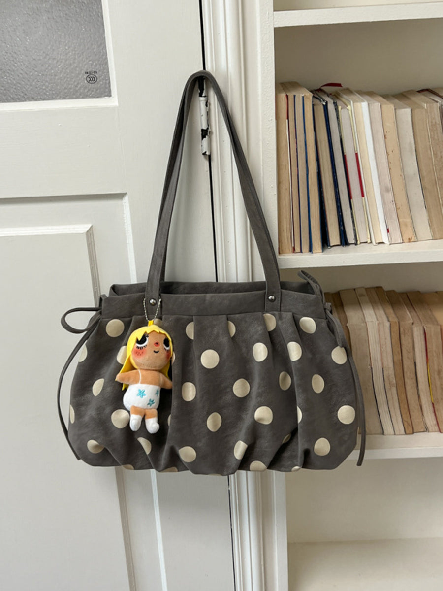 White shoulder bag with drawstring and polka dot