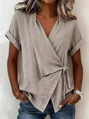 wrap top in light gray featuring tie-side and relaxed fit