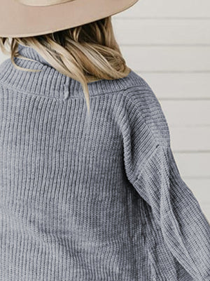 Drape-front ribbed knit cardigan in dark gray with a cowl neck.
