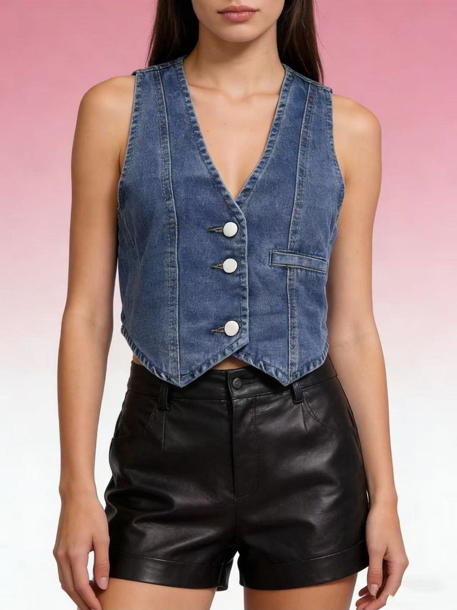 Chic button-down denim vest in dark blue with white buttons and a single chest pocket.