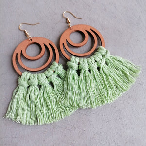 Light green tassel earrings with wooden double hoop detail