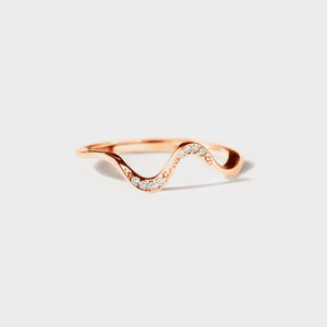 Rose gold serpentine diamond contour ring with a wavy design and small sparkling stones.