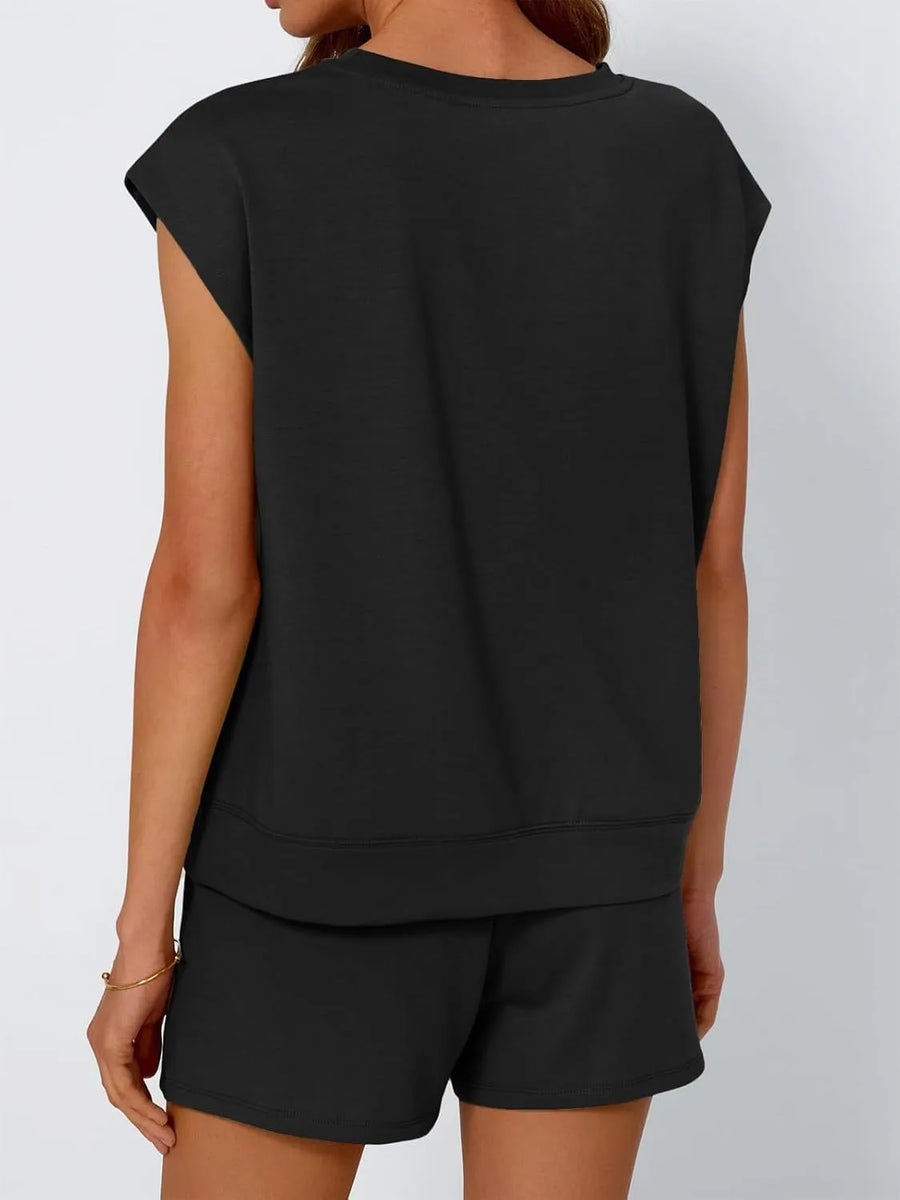 Black relaxed fit drawstring short set with sleeveless top and matching shorts.