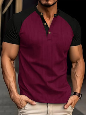 Burgundy raglan henley polo shirt with black sleeves and gold buttons