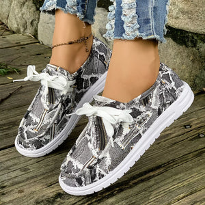 light blue sneakers featuring round toe and abstract