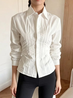 button-up shirt in white featuring buttoned and slim fit