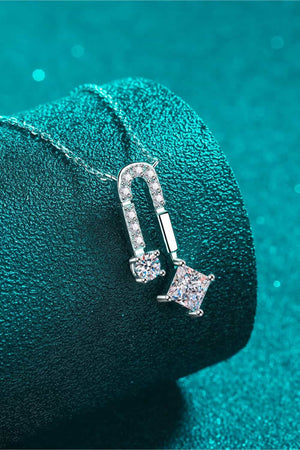 Silver geometric moissanite pendant necklace with clear cubic zirconia stones.
