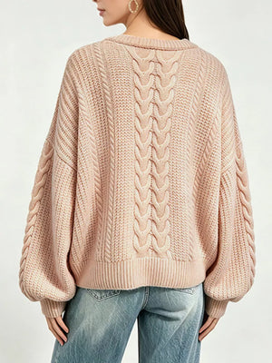 Beige pullover sweater featuring oversized and cable knit