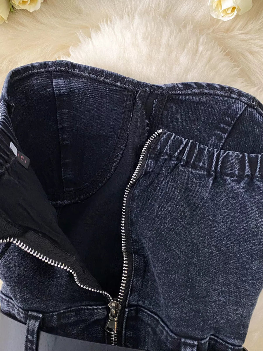 Black denim bustier bodysuit with front zipper and elasticized back detail