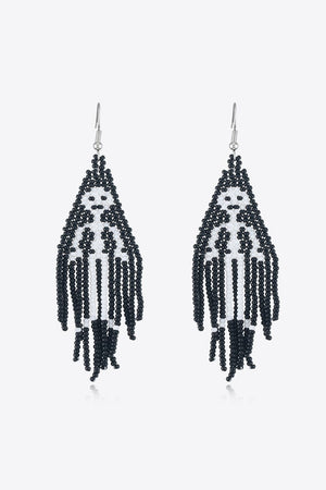 Black and white beaded ghost fringe earrings with dangling strands.