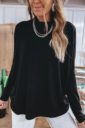 top in black featuring stretch and relaxed fit